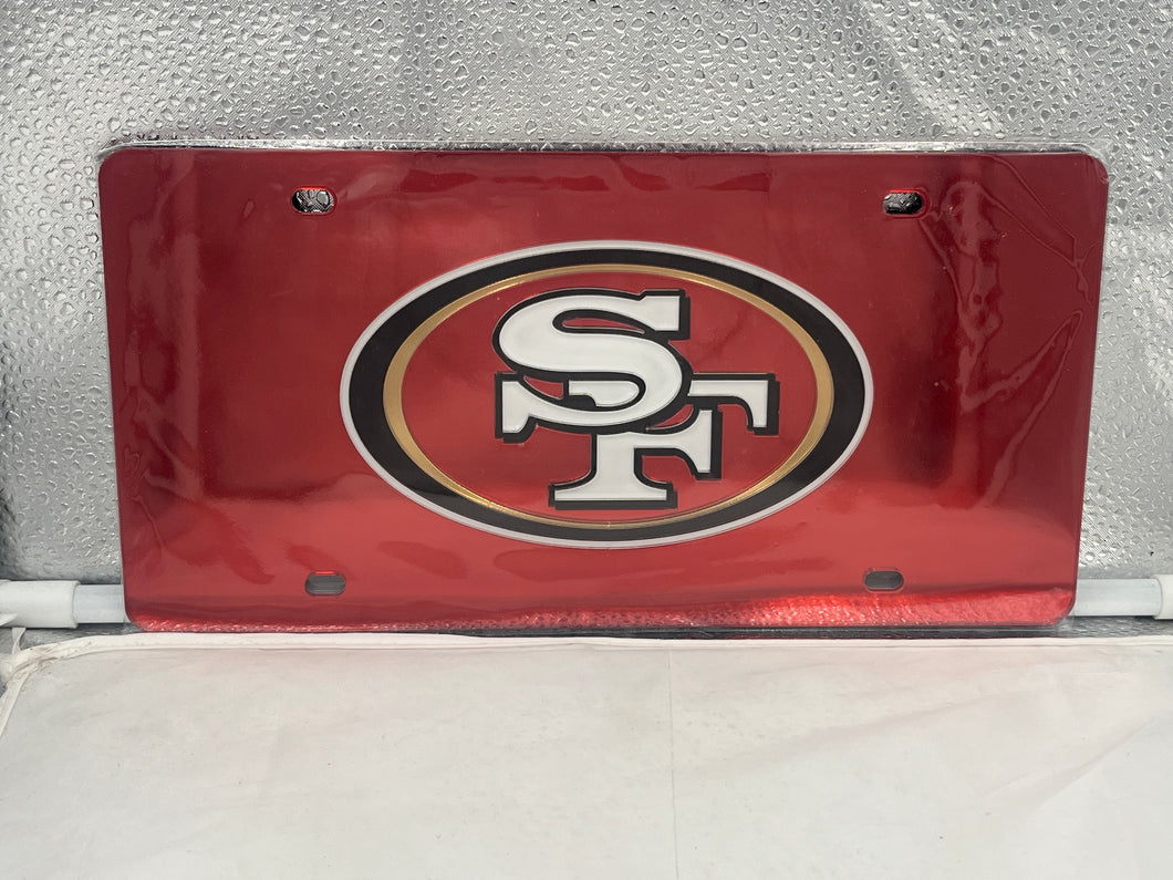 San Francisco 49ers NFL Red Reflective Lasercut License Plate from Wincraft featuring the iconic logo, vibrant red color, and sleek design, perfect for showcasing team spirit on your vehicle.