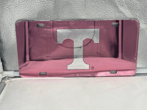 Tennessee Volunteers NCAA Pink Mirrored LaserCut License Plate by Craftique showcasing a vibrant pink mirrored finish and intricate LaserCut design of the Volunteers logo.