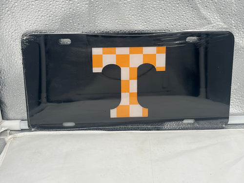 Tennessee Volunteers NCAA Black Mirrored Laser Cut License Plate by Craftique, showcasing a sleek design with a mirrored finish and laser-cut logo, perfect for displaying team spirit on any vehicle.