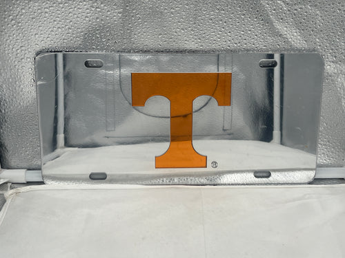 Tennessee Volunteers NCAA Silver Mirrored Laser Cut License Plate by Craftique showcasing the official team logo and sleek design, perfect for vehicle display and fan pride.