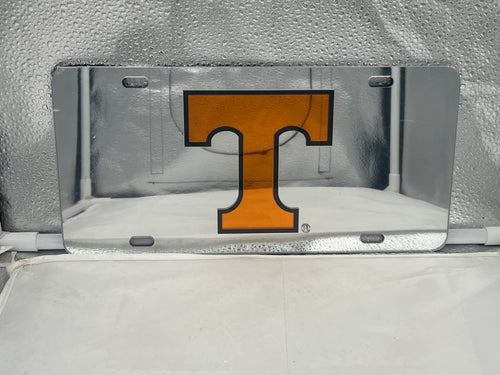 Tennessee Volunteers NCAA Silver Mirrored Laser Cut License Plate from Craftique, featuring the iconic logo in a stunning mirrored finish, ideal for vehicle decoration and showcasing team pride.