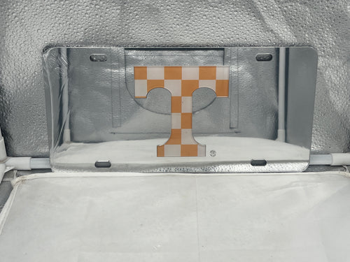 Tennessee Volunteers NCAA Silver Mirrored Laser Cut License Plate from Craftique showcasing intricate laser-cut designs and the Volunteers logo, perfect for displaying team spirit on any vehicle.
