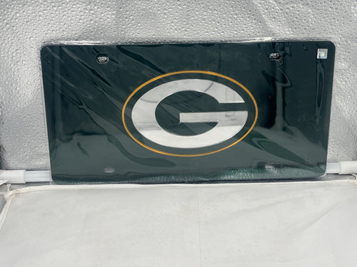 Green Bay Packers NFL Green Reflective Lasercut License Plate from WinCraft featuring a striking reflective finish and unique lasercut design, perfect for displaying team spirit while on the road.