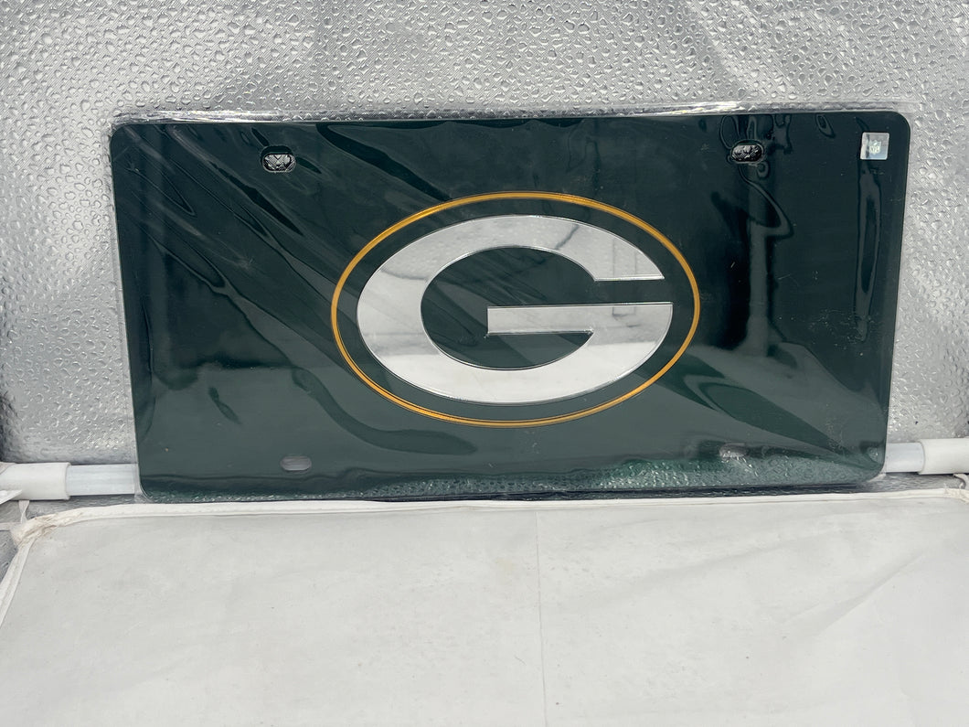 Green Bay Packers NFL Green Reflective Lasercut License Plate from WinCraft featuring a striking reflective finish and unique lasercut design, perfect for displaying team spirit while on the road.