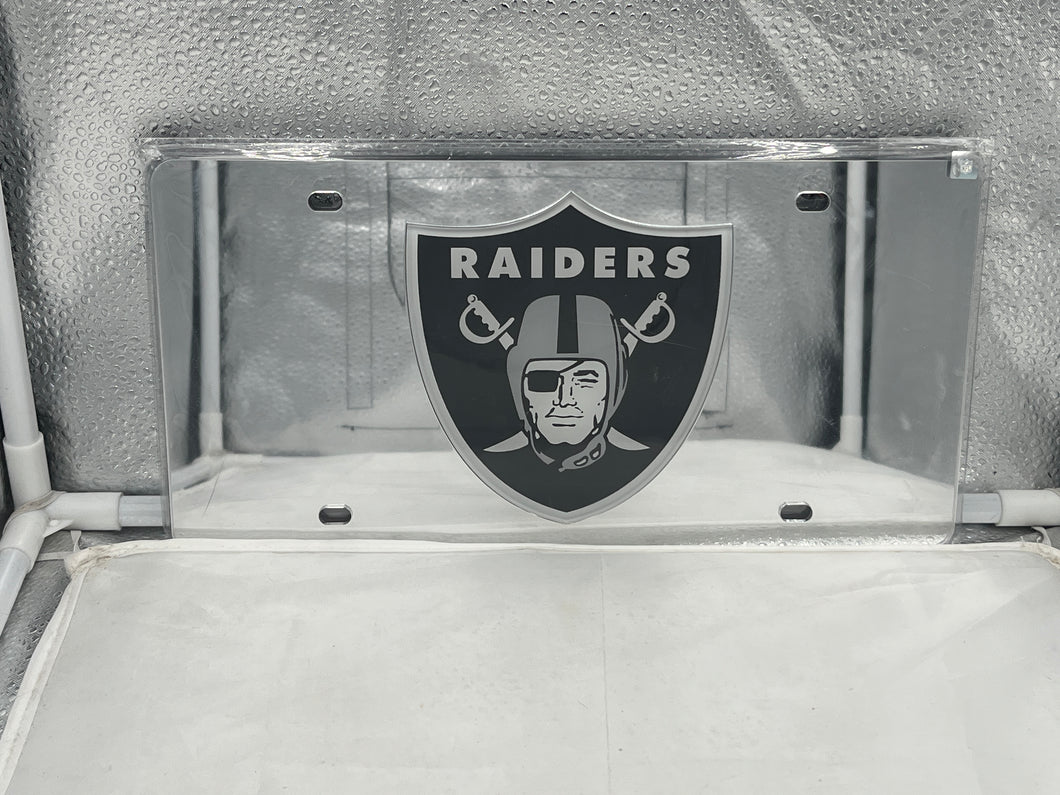 Las Vegas Raiders NFL Silver Reflective Lasercut License Plate by WinCraft showcasing the iconic Raiders logo in a shiny, durable design perfect for vehicle decoration and team spirit.