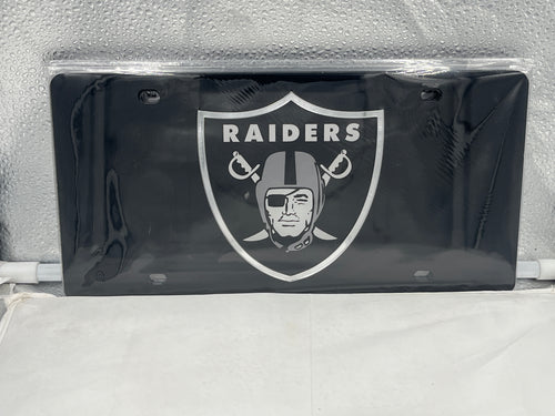 Las Vegas Raiders NFL Black Reflective Lasercut License Plate by WinCraft, showcasing the iconic Raiders logo with a high-quality reflective finish, perfect for displaying team spirit on your vehicle.