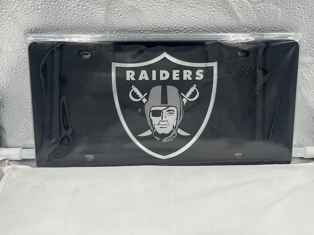 Las Vegas Raiders NFL Black Reflective Lasercut License Plate by WinCraft, showcasing the iconic Raiders logo with a high-quality reflective finish, perfect for displaying team spirit on your vehicle.