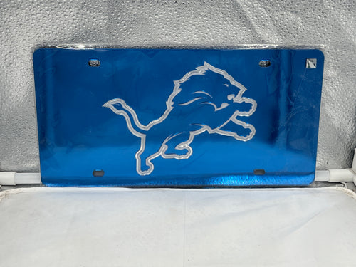 Detroit Lions NFL Blue Acrylic Lasercut License Plate by WinCraft showcasing vibrant team colors and detailed logo, perfect for fans to display their support on vehicles.
