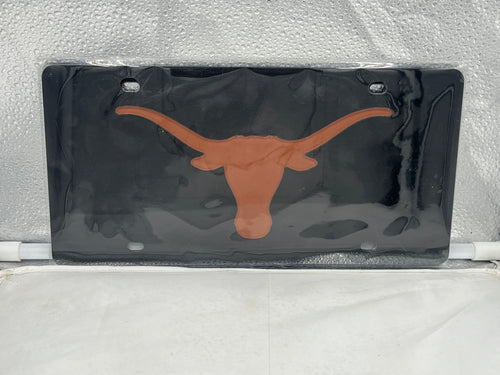 Texas Longhorns NCAA Black Acrylic Laser Cut License Plate from WinCraft showcasing bold Longhorns logo, perfect for fans to display school pride on vehicles.