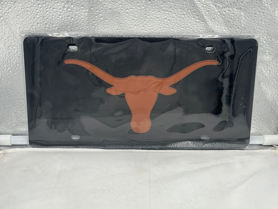 Texas Longhorns NCAA Black Acrylic Laser Cut License Plate from WinCraft showcasing bold Longhorns logo, perfect for fans to display school pride on vehicles.