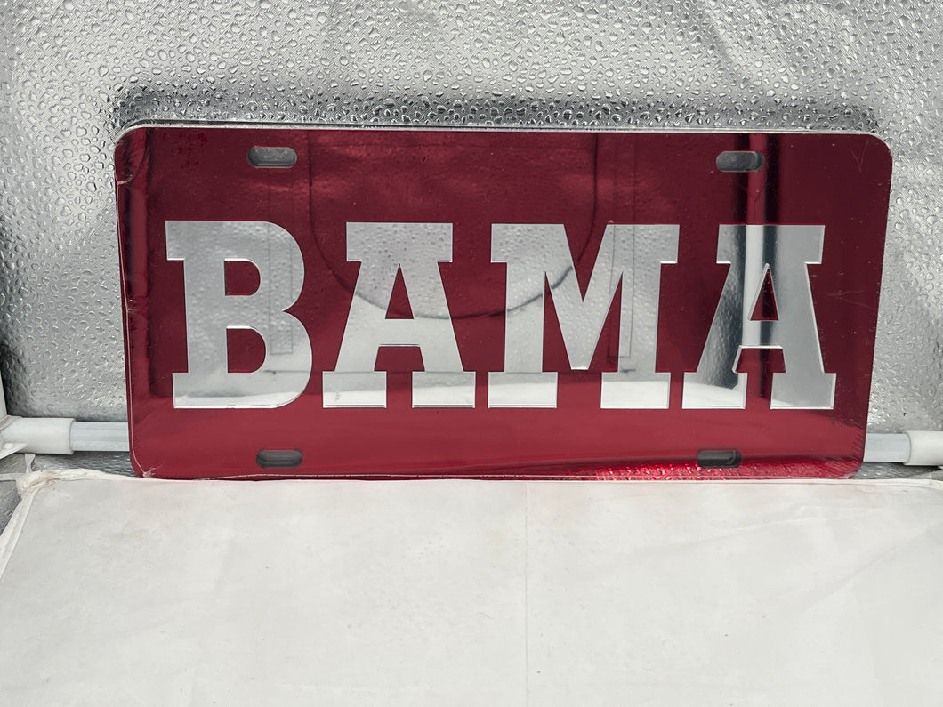 Alabama Crimson Tide NCAA Red Mirrored Laser Cut License Plate by Craftique, featuring a striking red mirrored finish and intricate laser-cut detailing, perfect for displaying team spirit on your vehicle.