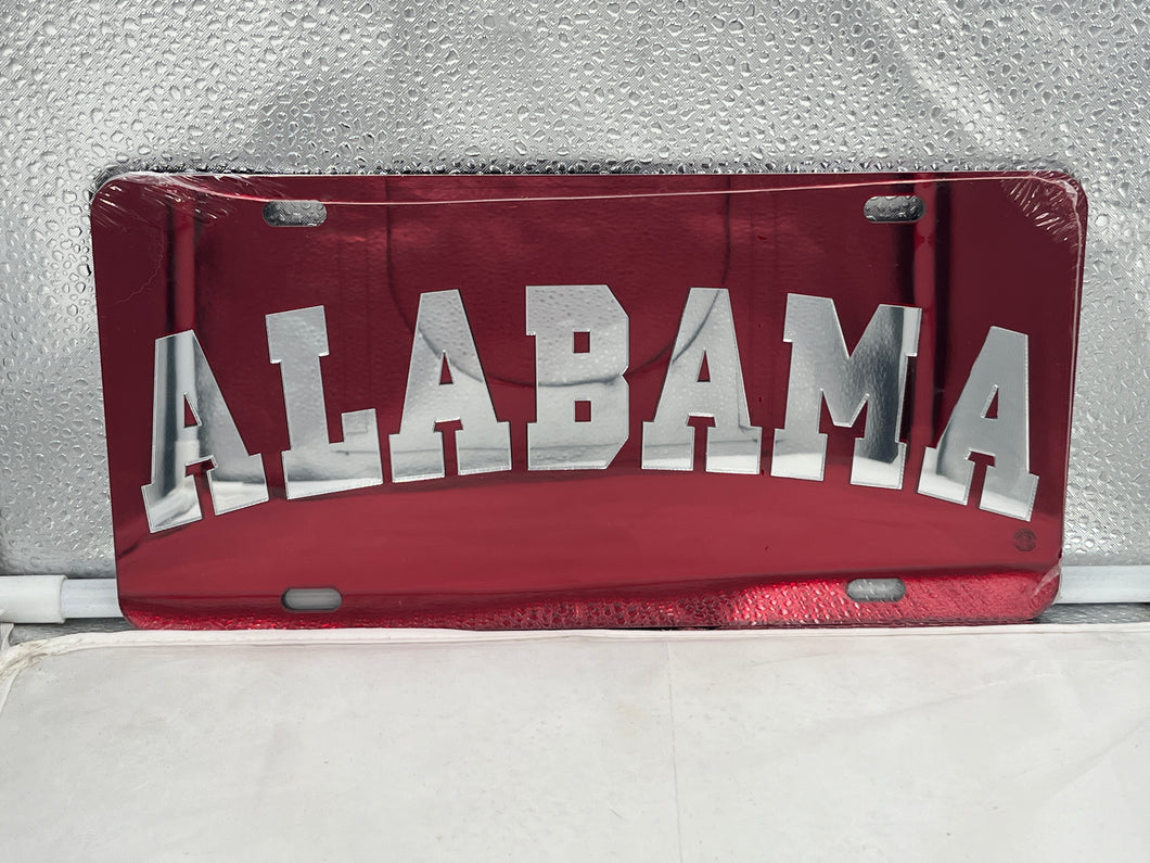 Alabama Crimson Tide NCAA Red Mirrored Laser Cut License Plate from Craftique showcasing the iconic team logo with a vibrant red finish, perfect for fans to display on vehicles or as a decorative piece.