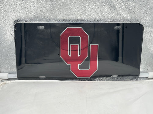 Oklahoma Sooners NCAA Black Mirrored Laser Cut License Plate by Craftique showcasing bold design and team pride for vehicle decoration.
