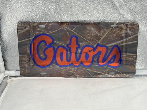 Florida Gators NCAA Camo Mirrored Laser Cut License Plate by Craftique, showcasing a rugged camo design and shiny mirrored finish, perfect for avid Gators fans.