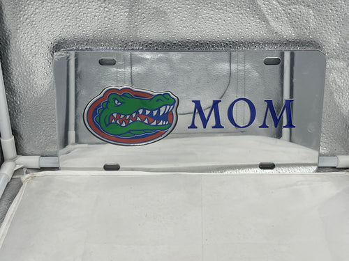 Florida Gators NCAA Silver Mirrored Laser Cut License Plate by Craftique showcasing intricate laser-cut design with a reflective finish, perfect for expressing team pride on vehicles.
