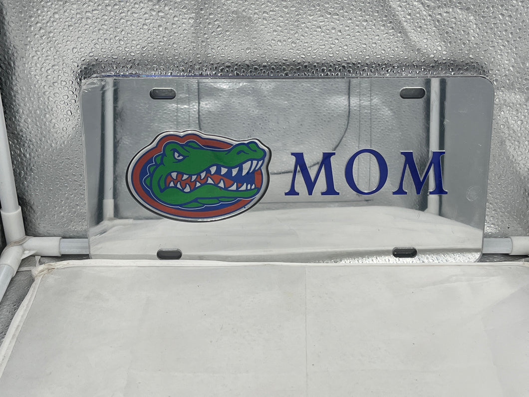 Florida Gators NCAA Silver Mirrored Laser Cut License Plate by Craftique showcasing intricate laser-cut design with a reflective finish, perfect for expressing team pride on vehicles.