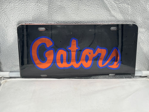 Florida Gators NCAA Black Mirrored Laser Cut License Plate by Craftique showcasing a striking design with the Gators logo, perfect for displaying team spirit on vehicles.