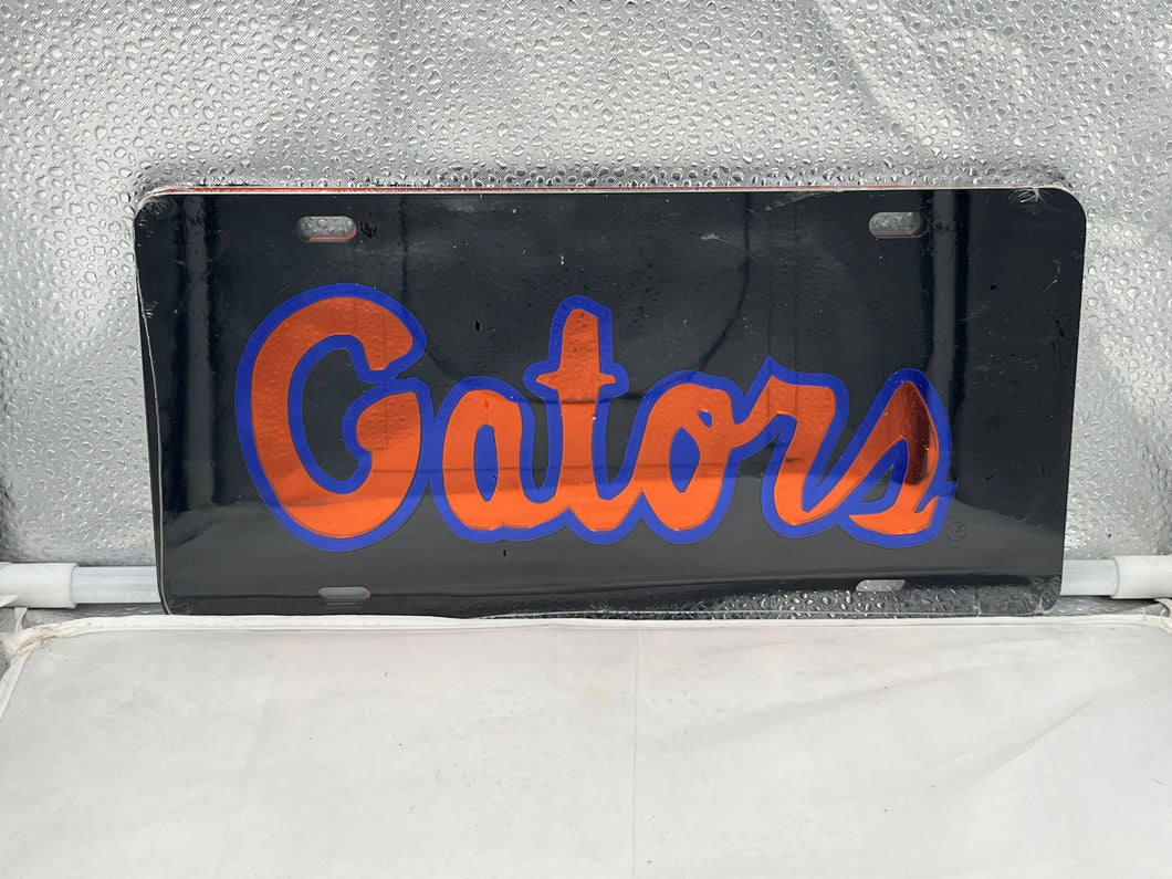 Florida Gators NCAA Black Mirrored Laser Cut License Plate by Craftique showcasing a striking design with the Gators logo, perfect for displaying team spirit on vehicles.