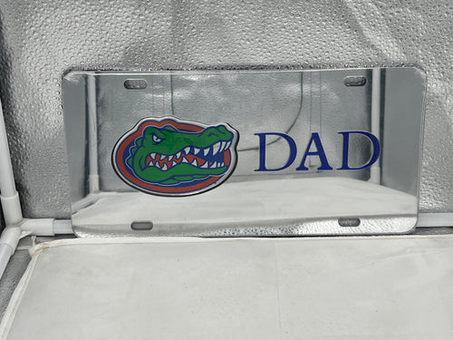 Florida Gators NCAA Silver Mirrored Laser Cut License Plate by Craftique showcasing a sleek silver finish and intricate laser-cut design featuring the iconic Gators logo, perfect for adding collegiate flair to any vehicle.