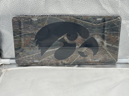 Iowa Hawkeyes NCAA Camo Mirrored Laser Cut License Plate Craftique showcasing camo design and mirrored finish, perfect for displaying team pride on vehicles.