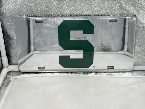 Michigan State Spartans NCAA Silver Mirrored Laser Cut License Plate from Craftique, showcasing a sleek design perfect for displaying team pride on vehicles or as home decor.