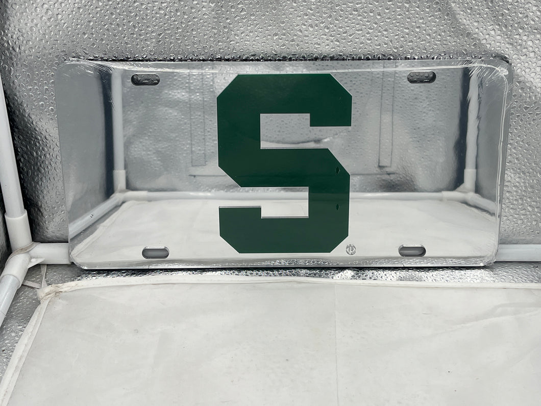 Michigan State Spartans NCAA Silver Mirrored Laser Cut License Plate from Craftique, showcasing a sleek design perfect for displaying team pride on vehicles or as home decor.