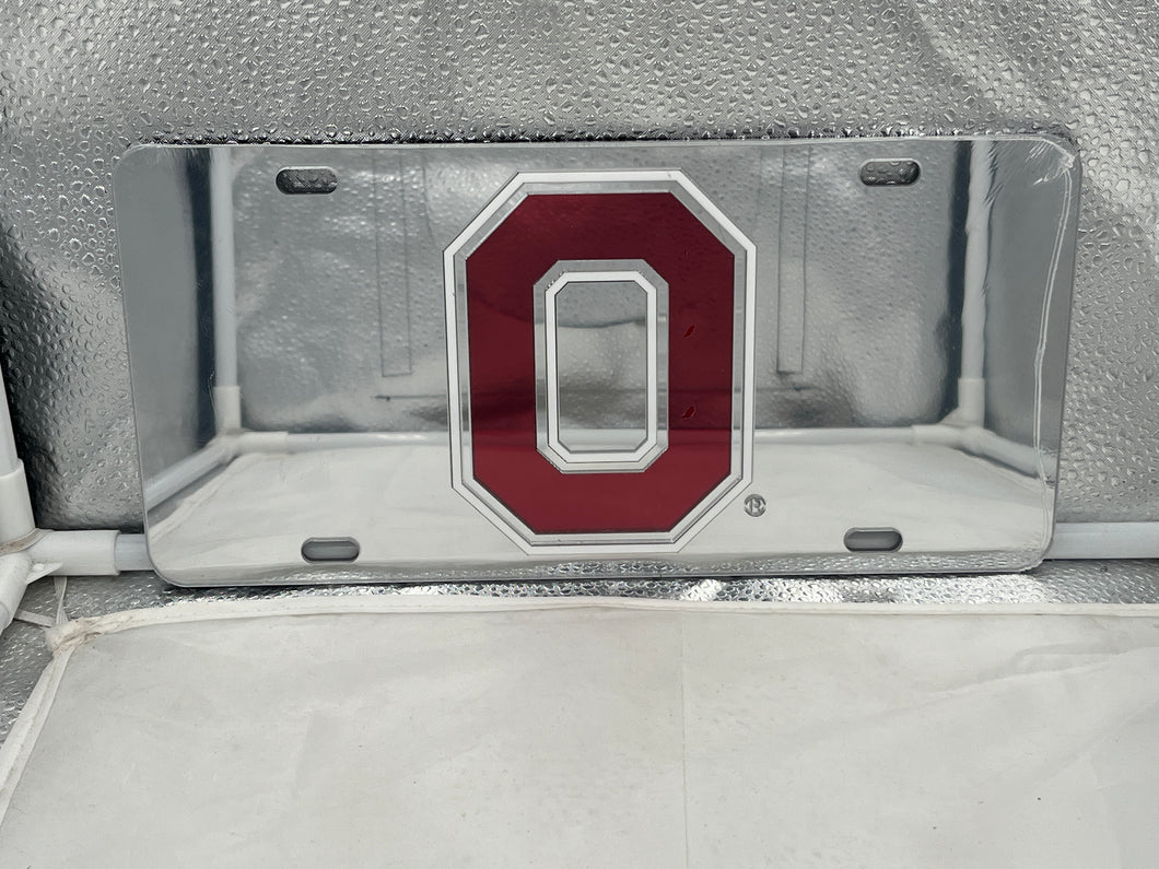 Ohio State Buckeyes NCAA Silver Mirrored Laser Cut License Plate by Craftique displaying the iconic team logo with a striking silver mirrored finish, perfect for showcasing support for the Buckeyes on vehicles.