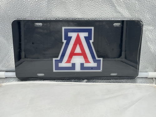 Arizona Wildcats NCAA Black Mirrored Laser Cut License Plate Craftique featuring a sleek design and prominent Arizona Wildcats logo, perfect for showcasing team spirit with an eye-catching black mirrored finish. Ideal for fans looking to enhance their vehicle's appearance with an Arizona Wildcats license plate.