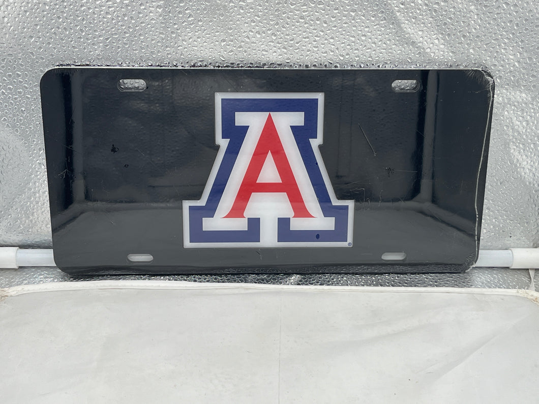 Arizona Wildcats NCAA Black Mirrored Laser Cut License Plate Craftique featuring a sleek design and prominent Arizona Wildcats logo, perfect for showcasing team spirit with an eye-catching black mirrored finish. Ideal for fans looking to enhance their vehicle's appearance with an Arizona Wildcats license plate.