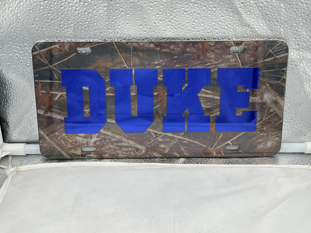 Duke Blue Devils NCAA Camo Acrylic Laser Cut License Plate from Craftique showcasing durable construction and vibrant camo design for team spirit display.