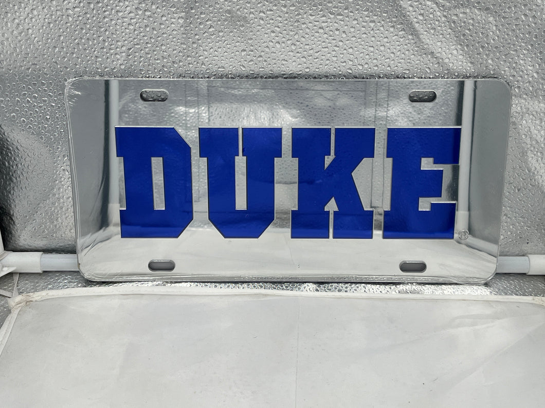 Duke Blue Devils NCAA Silver Mirrored Laser Cut License Plate by Craftique showing stylish design and logo, perfect for car accessories and fan decor.