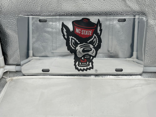 NC State Wolfpack NCAA Silver Mirrored Laser Cut License Plate by Craftique showcasing the iconic logo with a reflective finish, perfect for displaying team pride on your vehicle.