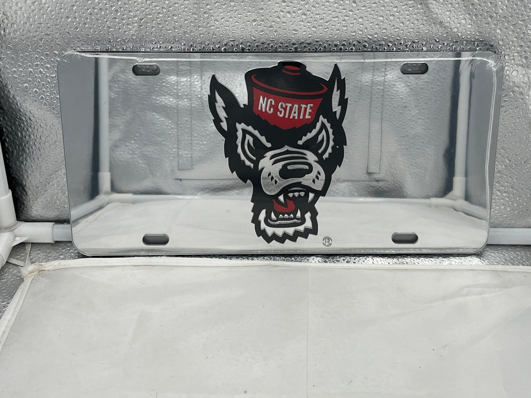 NC State Wolfpack NCAA Silver Mirrored Laser Cut License Plate by Craftique showcasing the iconic logo with a reflective finish, perfect for displaying team pride on your vehicle.
