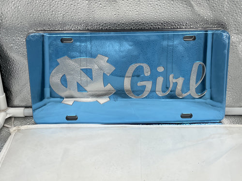 North Carolina Tar Heels NCAA Blue Mirrored Laser Cut License Plate by Craftique, featuring vibrant blue color and precise logo design, perfect for showcasing team pride on your vehicle.