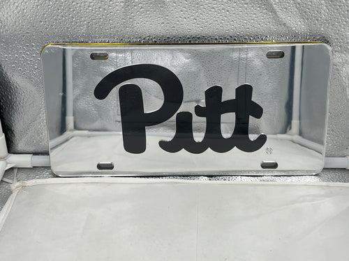 Pitt Panthers NCAA Silver Mirrored Laser Cut License Plate by Craftique, showcasing a stylish silver finish and detailed laser-cut design, perfect for vehicle display to show off team spirit.