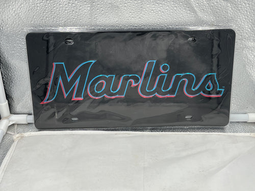 Miami Marlins MLB Black Acrylic Lasercut License Plate from WinCraft, showcasing intricate lasercut details of the iconic Miami Marlins logo on a sleek black acrylic design, perfect for avid fans and durable for all weather conditions.