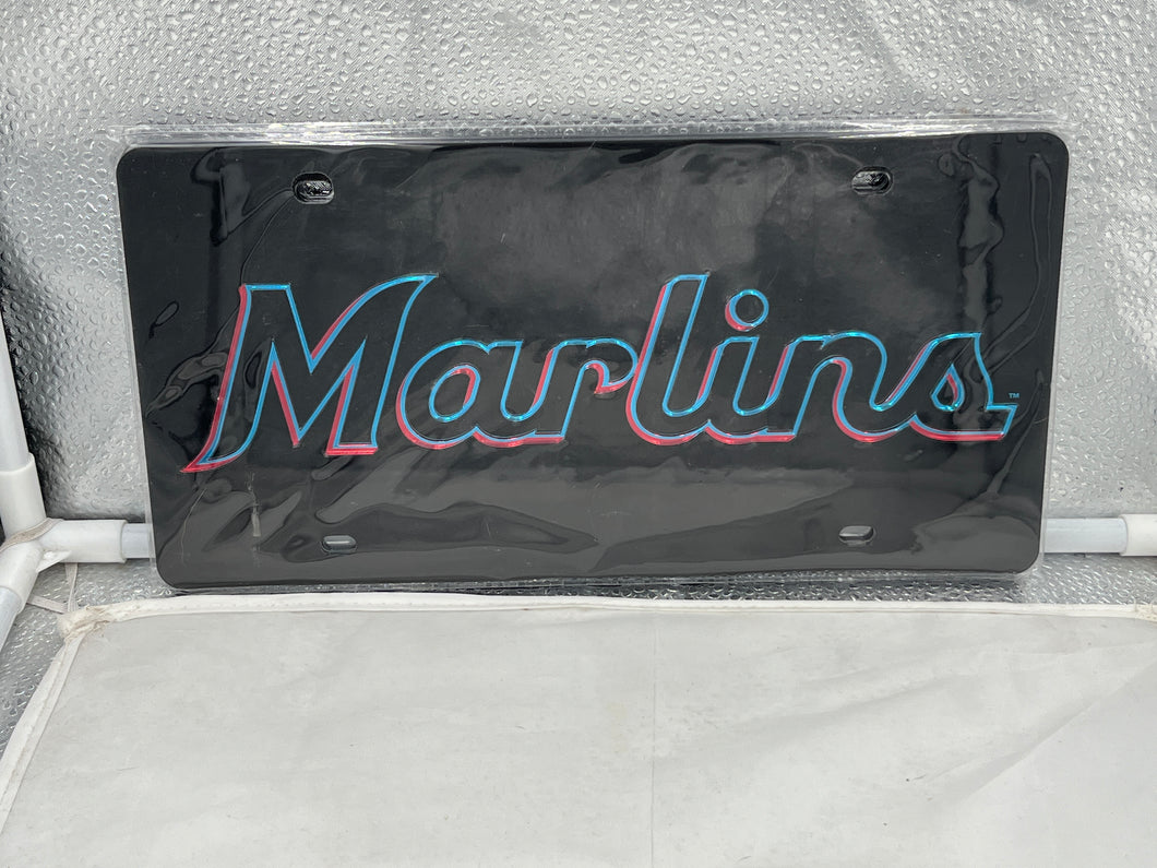 Miami Marlins MLB Black Acrylic Lasercut License Plate from WinCraft, showcasing intricate lasercut details of the iconic Miami Marlins logo on a sleek black acrylic design, perfect for avid fans and durable for all weather conditions.