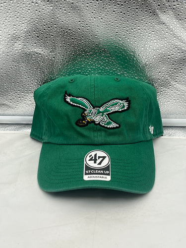 a green hat with an eagle embroidered on it