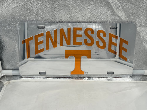 Tennessee Volunteers NCAA Silver Mirrored Laser Cut License Plate from Craftique featuring a sleek design, stainless steel finish, and intricate laser-cut detailing for vehicle decor.
