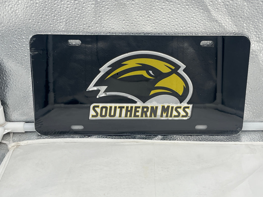 Southern Miss Golden Eagles NCAA Mirrored Laser Cut License Plate by Craftique, showcasing a uniquely shaped logo with a reflective finish, perfect for displaying team pride on vehicles.