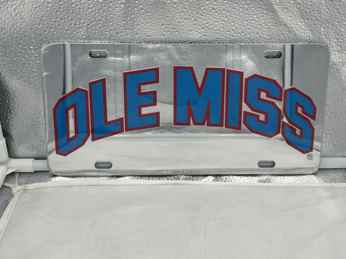 Ole Miss Rebels NCAA Silver Mirrored Laser Cut License Plate from Craftique showcasing its shimmering silver finish and intricate laser cut logo, perfect for displaying team spirit on your vehicle.