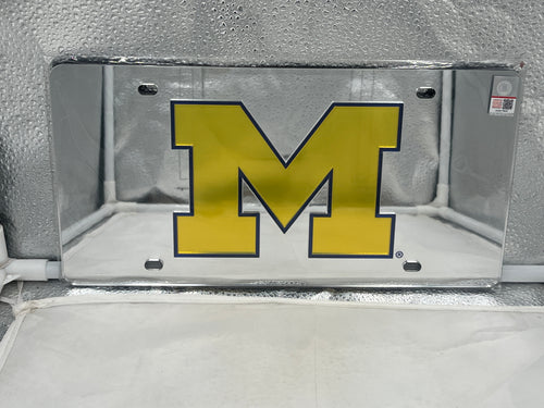 Michigan Wolverines NCAA Silver Mirrored Laser Cut License Plate by WinCraft, showcasing laser-cut logo and sleek mirrored finish, perfect for displaying team spirit.