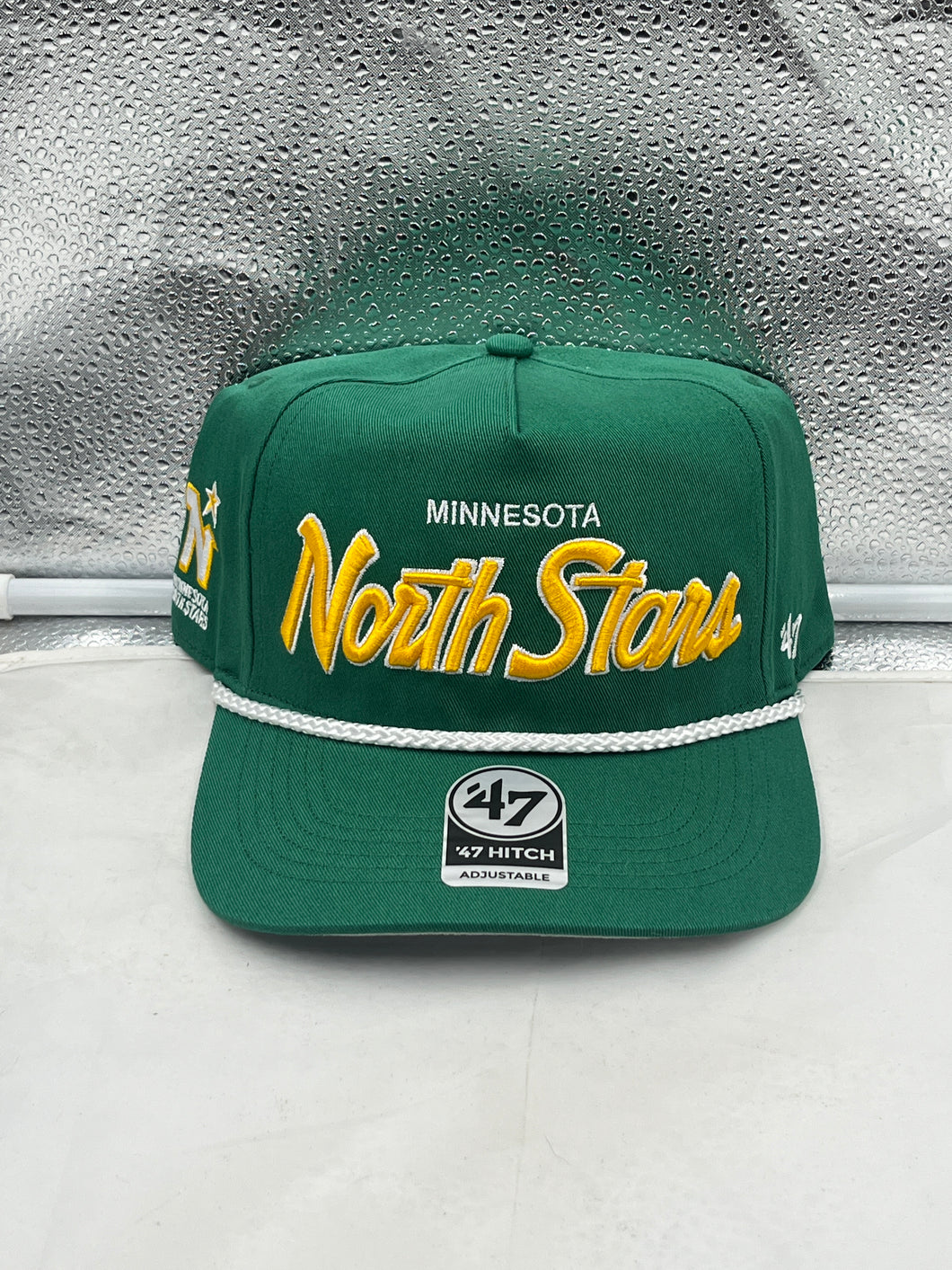 Minnesota North Stars NHL '47 Throwback Green Hitch Rope Adjustable Snapback Hat showcasing vibrant green color and classic logo.