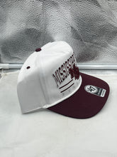 Load image into Gallery viewer, Model wearing the Mississippi State Bulldogs NCAA &#39;47 White TT Hitch Rope Adjustable Snapback Hat at a tailgate event.
