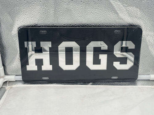 Arkansas Razorbacks NCAA Black Mirrored Laser Cut License Plate by Craftique, featuring a stunning black mirrored finish and laser-cut logo design, ideal for showcasing team spirit and enhancing vehicle style.