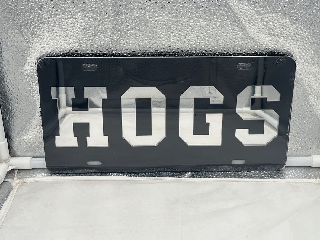 Arkansas Razorbacks NCAA Black Mirrored Laser Cut License Plate by Craftique, featuring a stunning black mirrored finish and laser-cut logo design, ideal for showcasing team spirit and enhancing vehicle style.