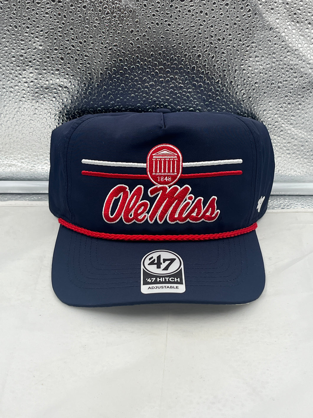 Ole Miss Rebels NCAA '47 Brand Navy Blue Hitch Rope Adjustable Snapback Hat displayed at an angle, showcasing the vibrant navy color and the iconic team logo.